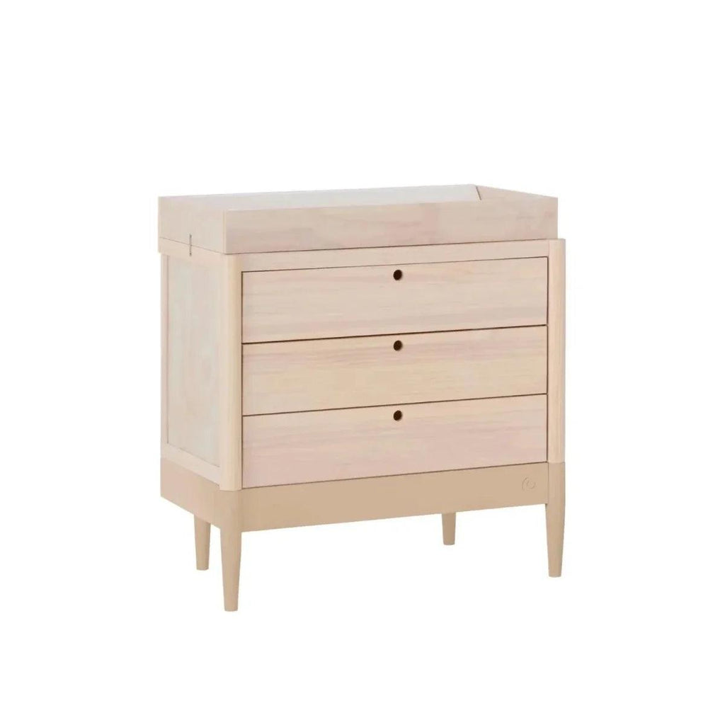 Baby dresser with three drawers and changing top in powder blush and natural ash side view