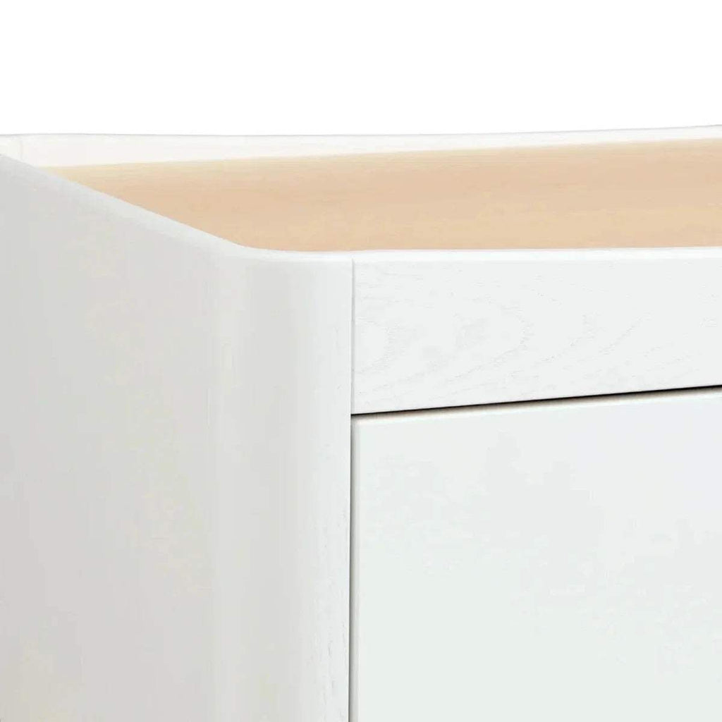 White bed frame corner detail with smooth joint and flat end panel