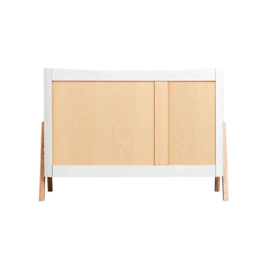 White bed frame with natural wood front panel and side supports, vertical posts