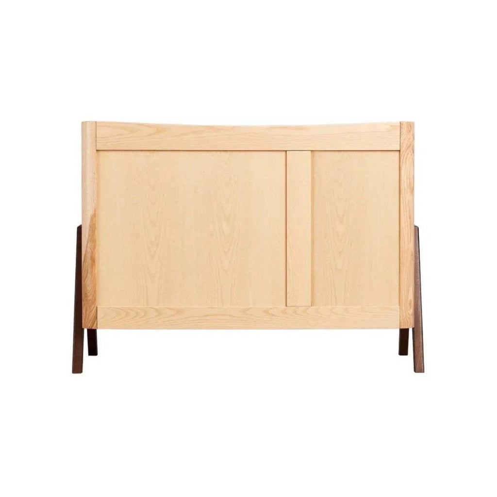 Natural wood baby cot bed end panel with solid guard and dark brown legs
