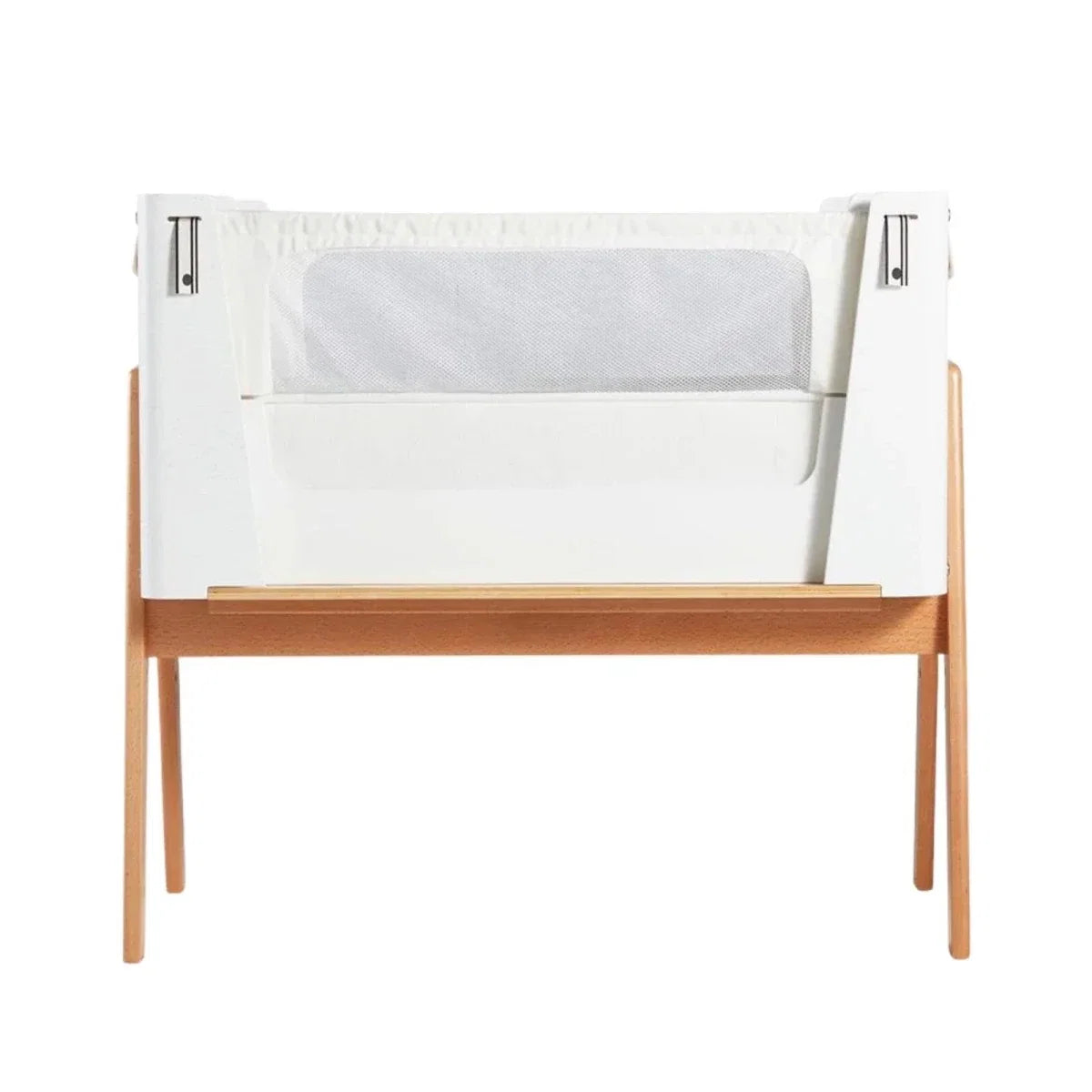 White and natural bedside crib with open side panels and mesh window
