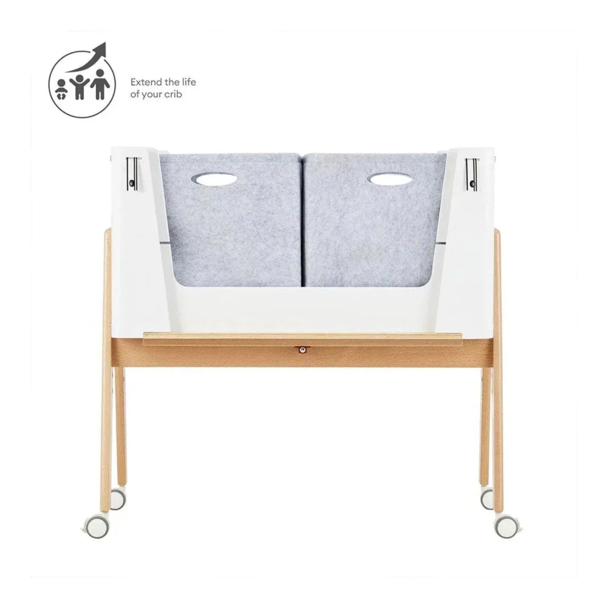 White and natural baby bedside crib with gray padded liner sections