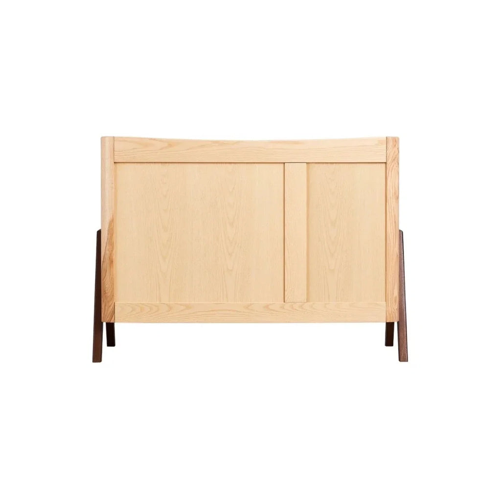 Back view of natural wood baby dresser with two hinged side panels