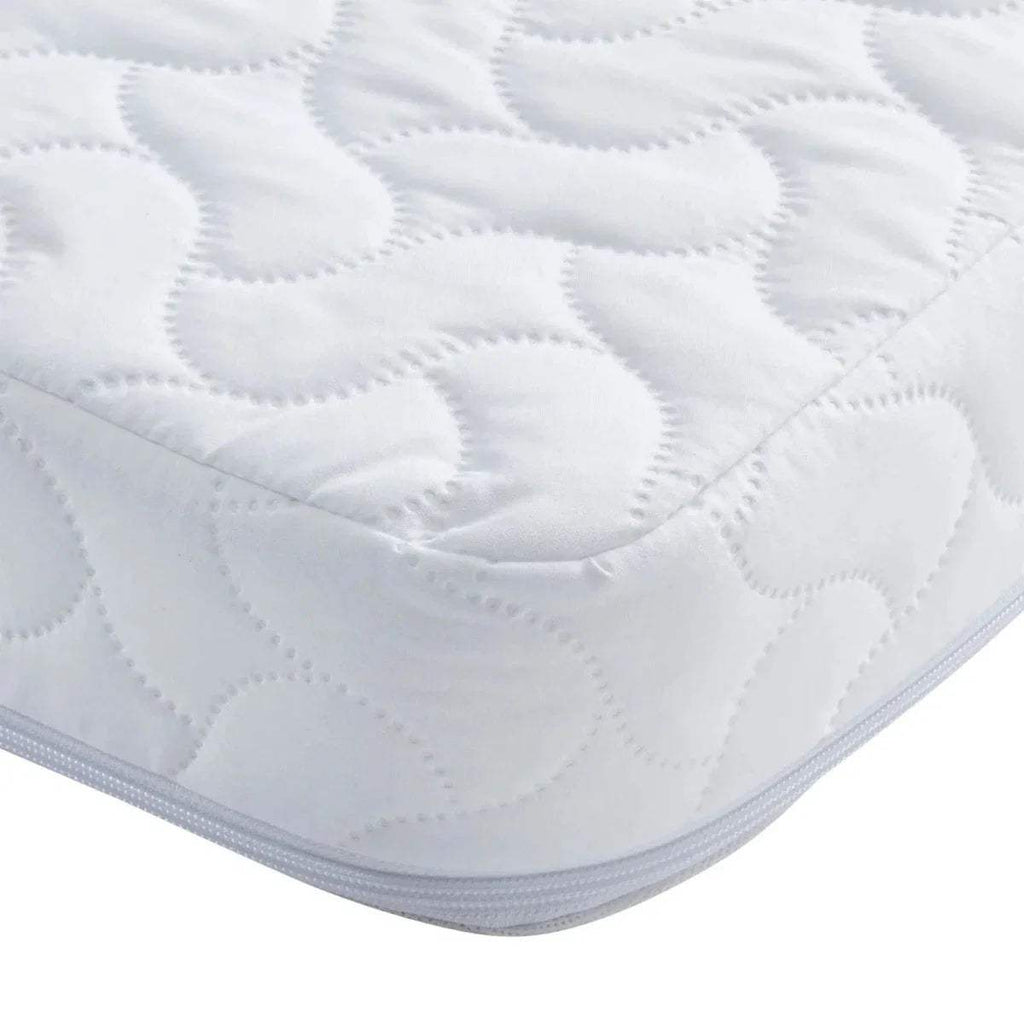 White quilted mattress top with stitched circular padding pattern and padded border.