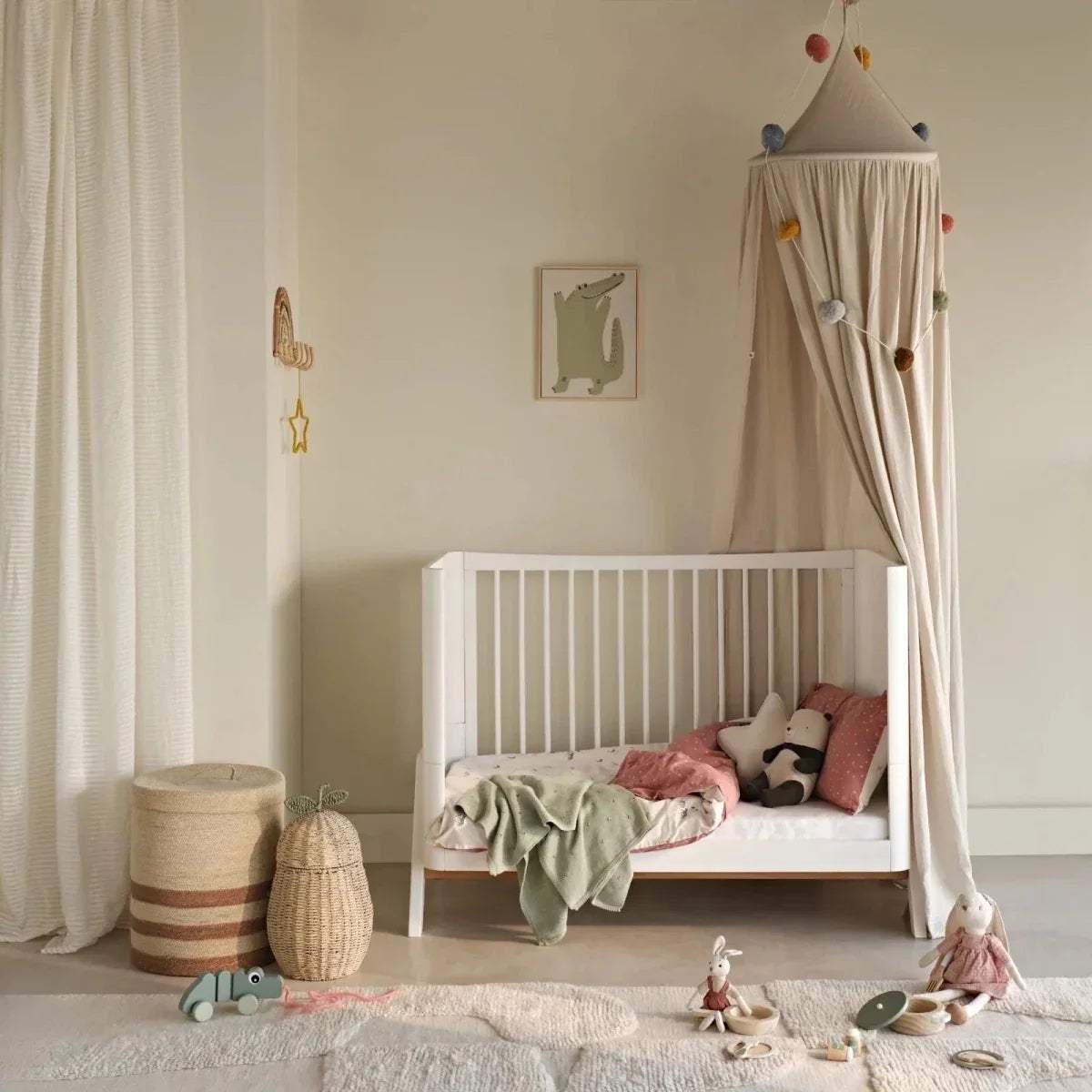 Baby cot bed fitted sheet, white, on mattress in nursery setup