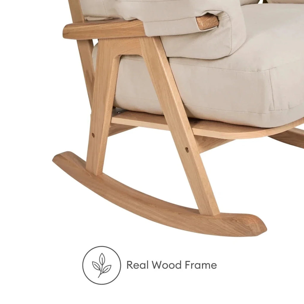 Gaia Baby Hera rocking chair close-up of light oak rocker base and padded armrest