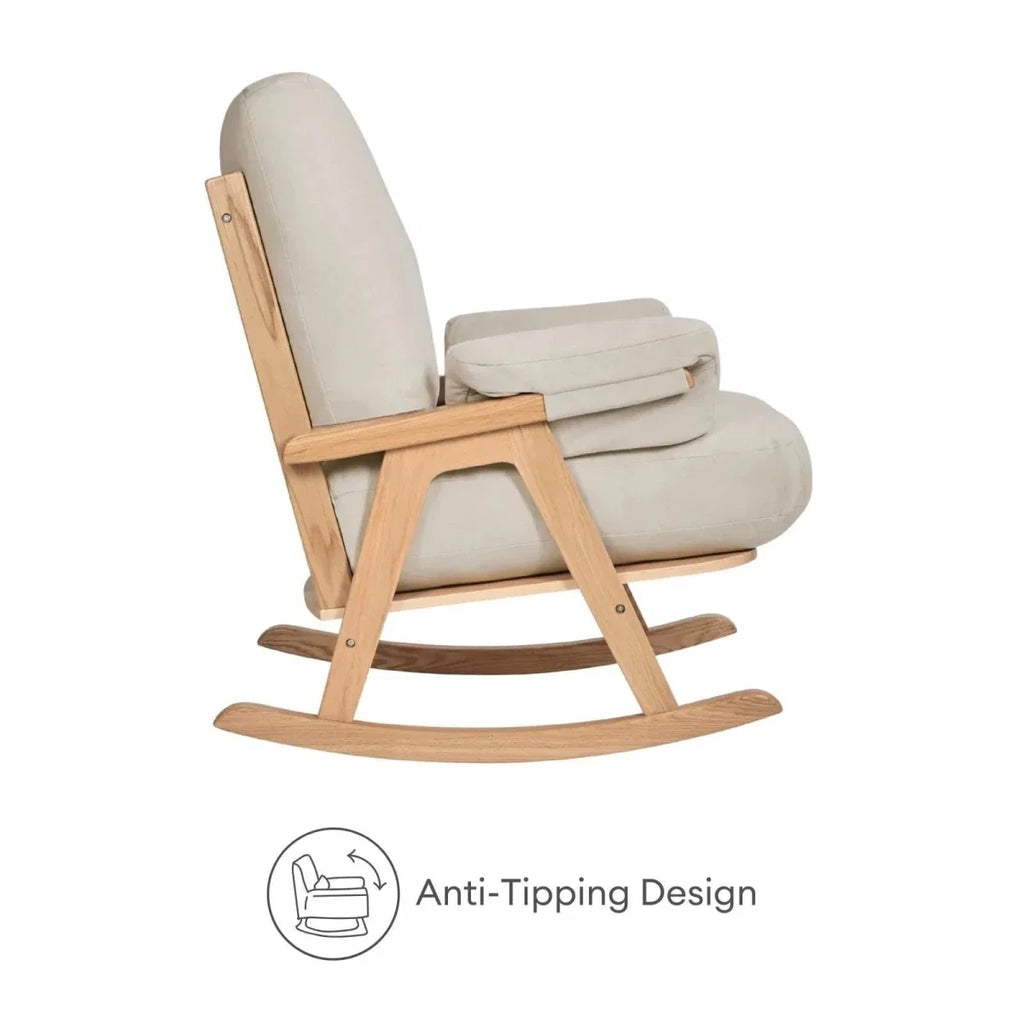 Gaia Baby Hera rocking chair side view with off-white upholstery and light oak frame