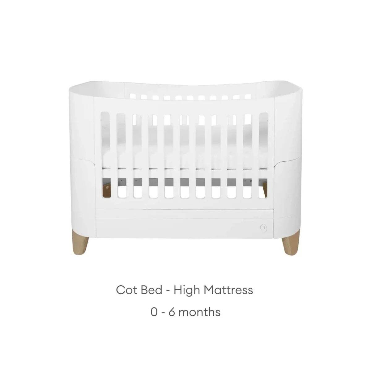 White cot bed with tall slat guard, curved sides, and natural wooden legs
