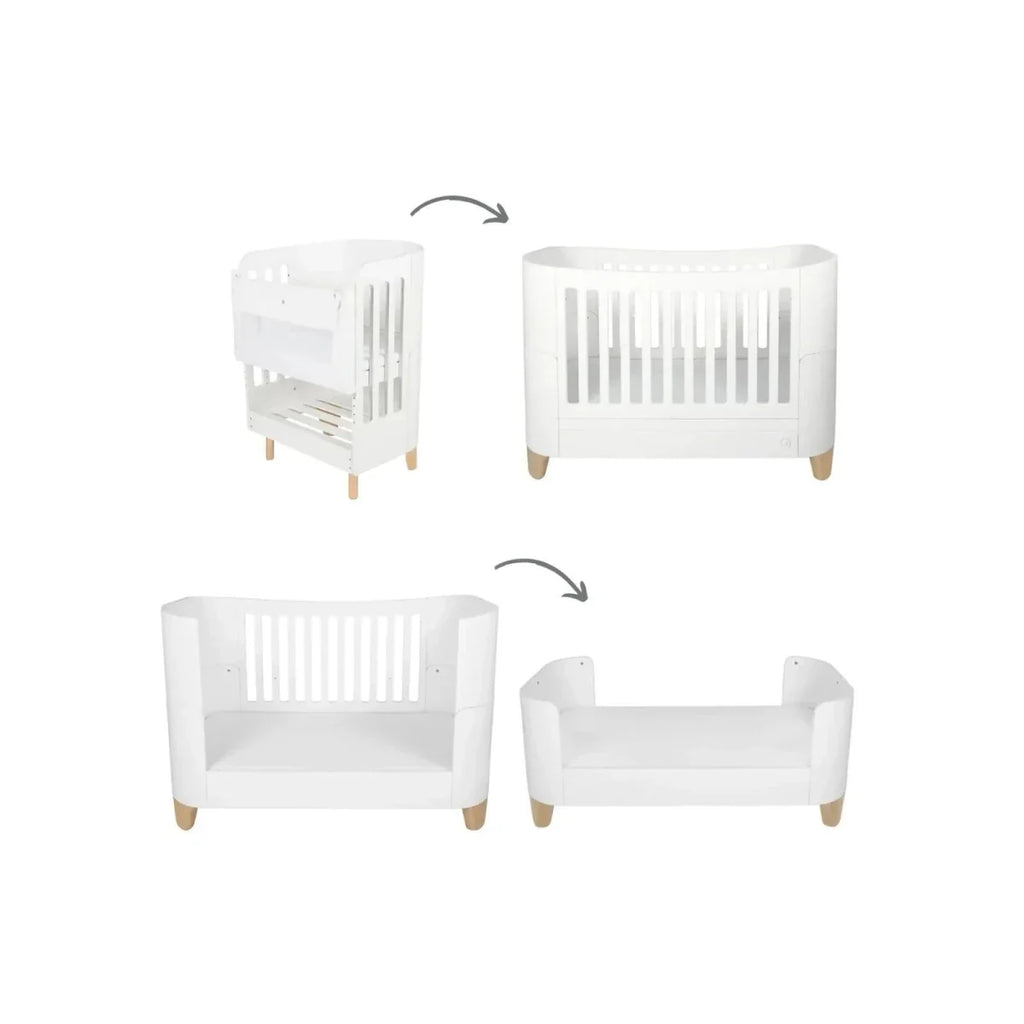 White cot bed with high rail, curved sides and vertical slat ends, natural wood feet
