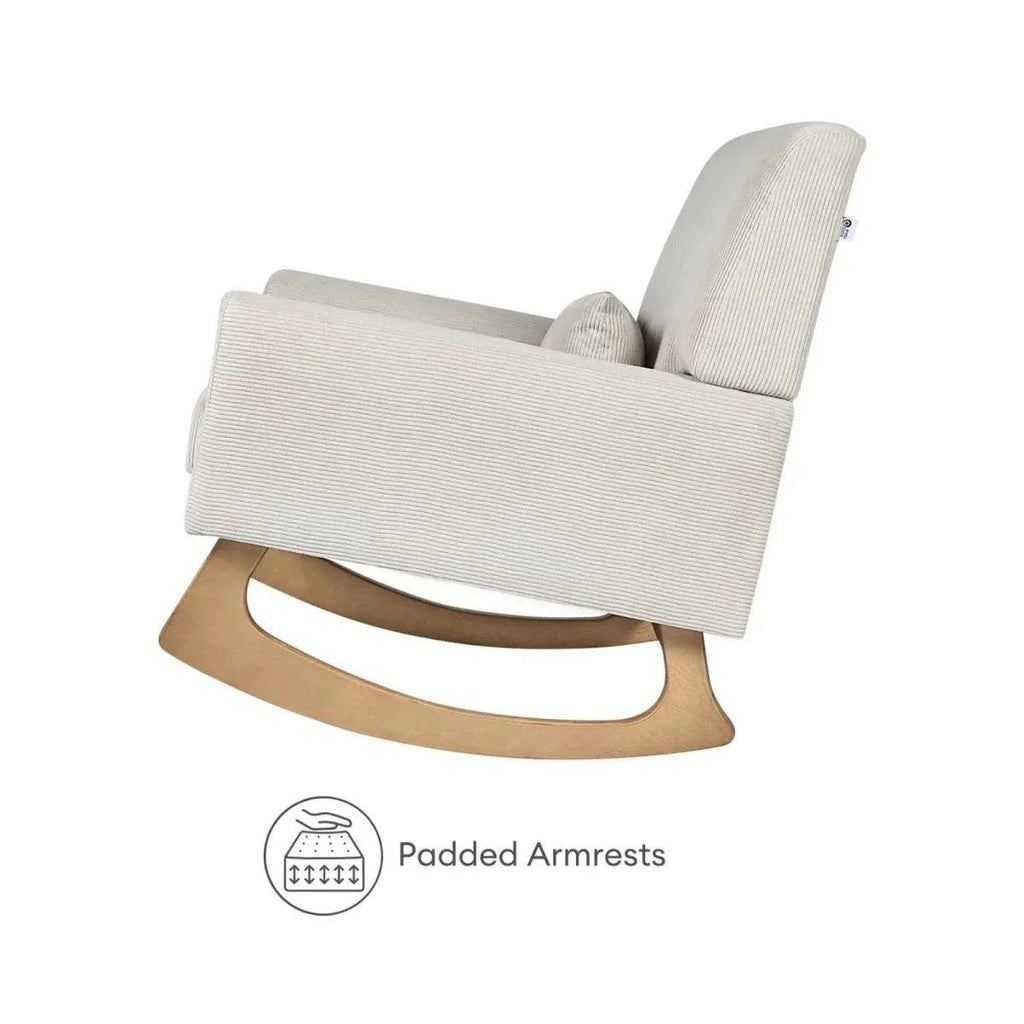 Ecru corduroy nursing chair with padded armrests and smooth curved rocker