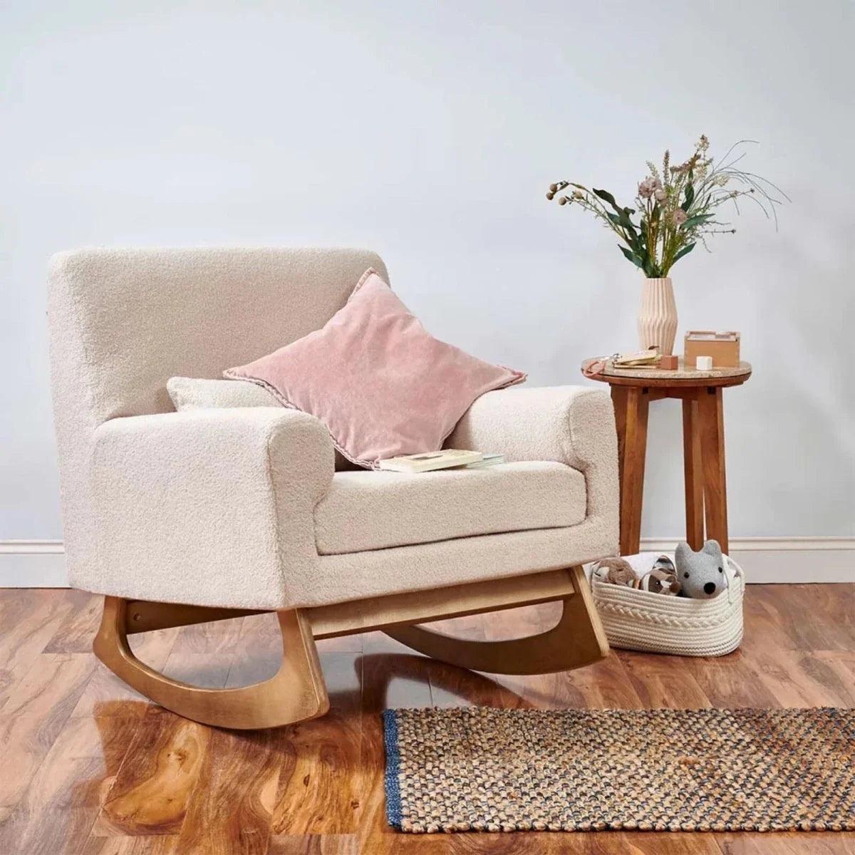Beige boucle baby rocking & nursing chair with curved wooden rockers and armrests