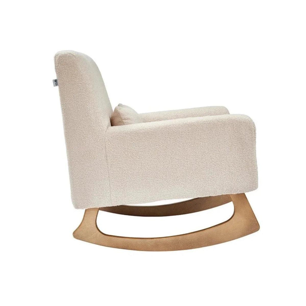 Beige boucle baby rocking & nursing chair side view with curved wooden rocker base