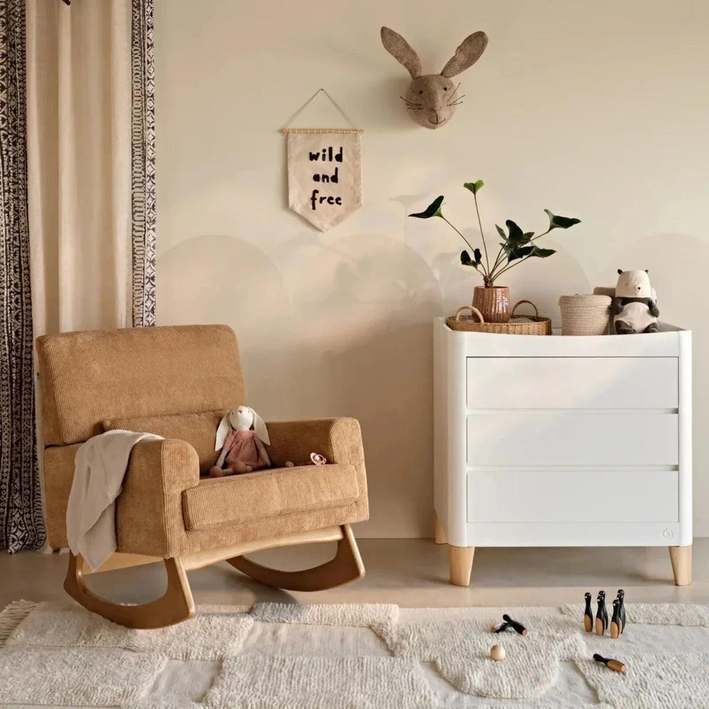 Caramel corduroy rocking nursing chair with cushioned seat and curved wooden rockers