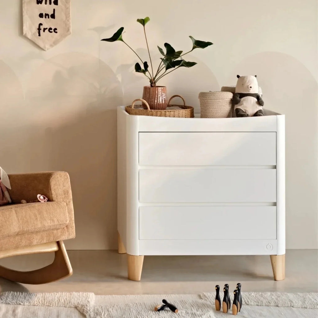 White and natural baby dresser with three drawers and solid wood legs