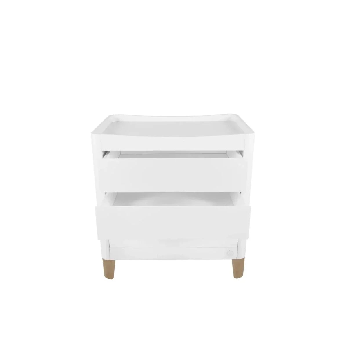White baby dresser with changing tray, open shelves, and natural wood legs