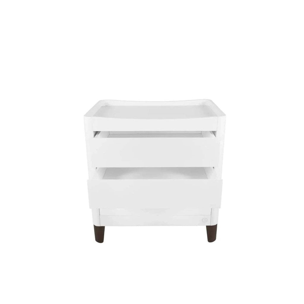 White baby dresser front view with three drawers and walnut legs