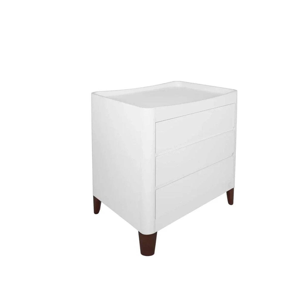 White baby dresser side view with drawers and walnut legs