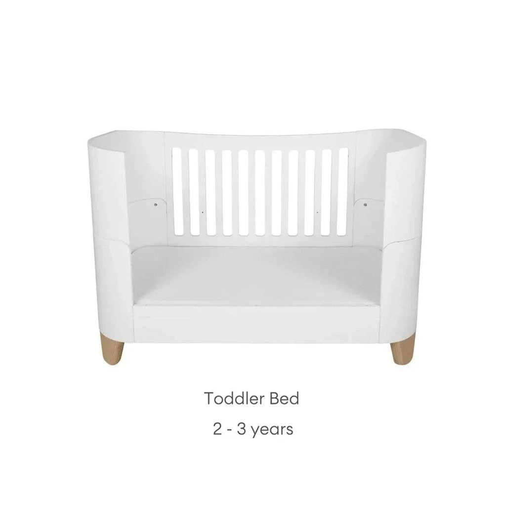 White toddler bed with curved sides and open front