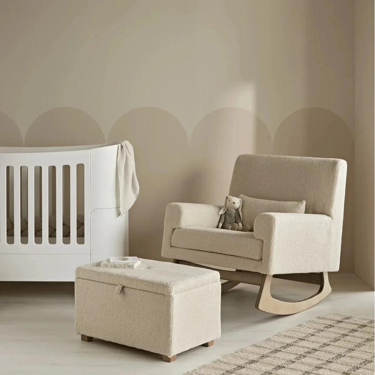 Beige boucle footstool with hinged lid and four wooden legs