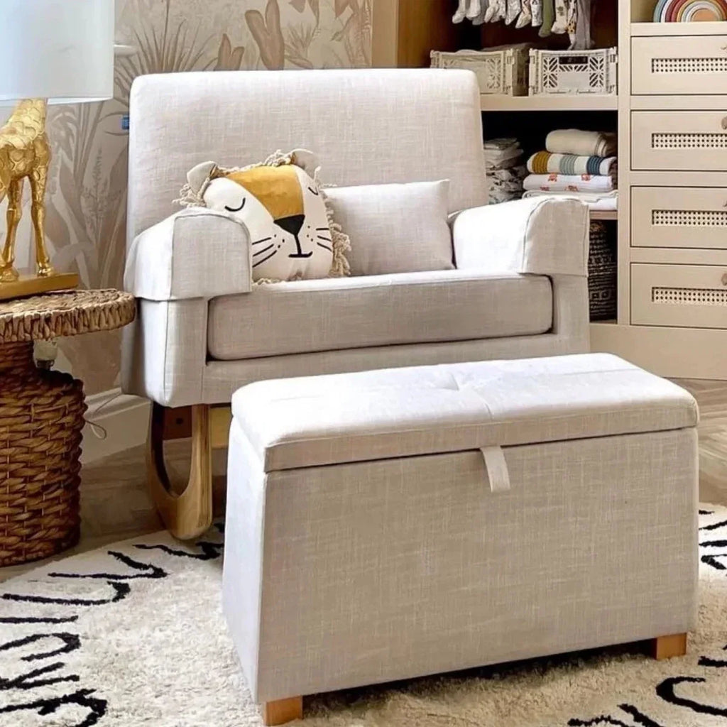 Oat upholstered footstool with hinged lid, fabric ribbon detail, and wooden legs