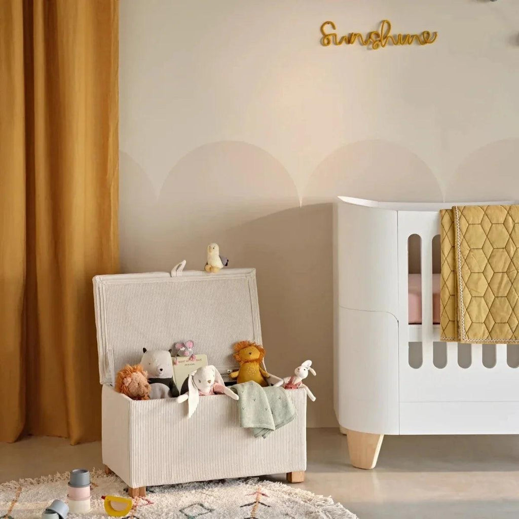 Ecru corduroy baby storage footstool with top lid and sturdy wooden legs