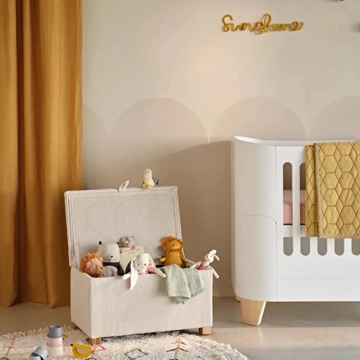 Ecru corduroy baby storage footstool with top lid and sturdy wooden legs