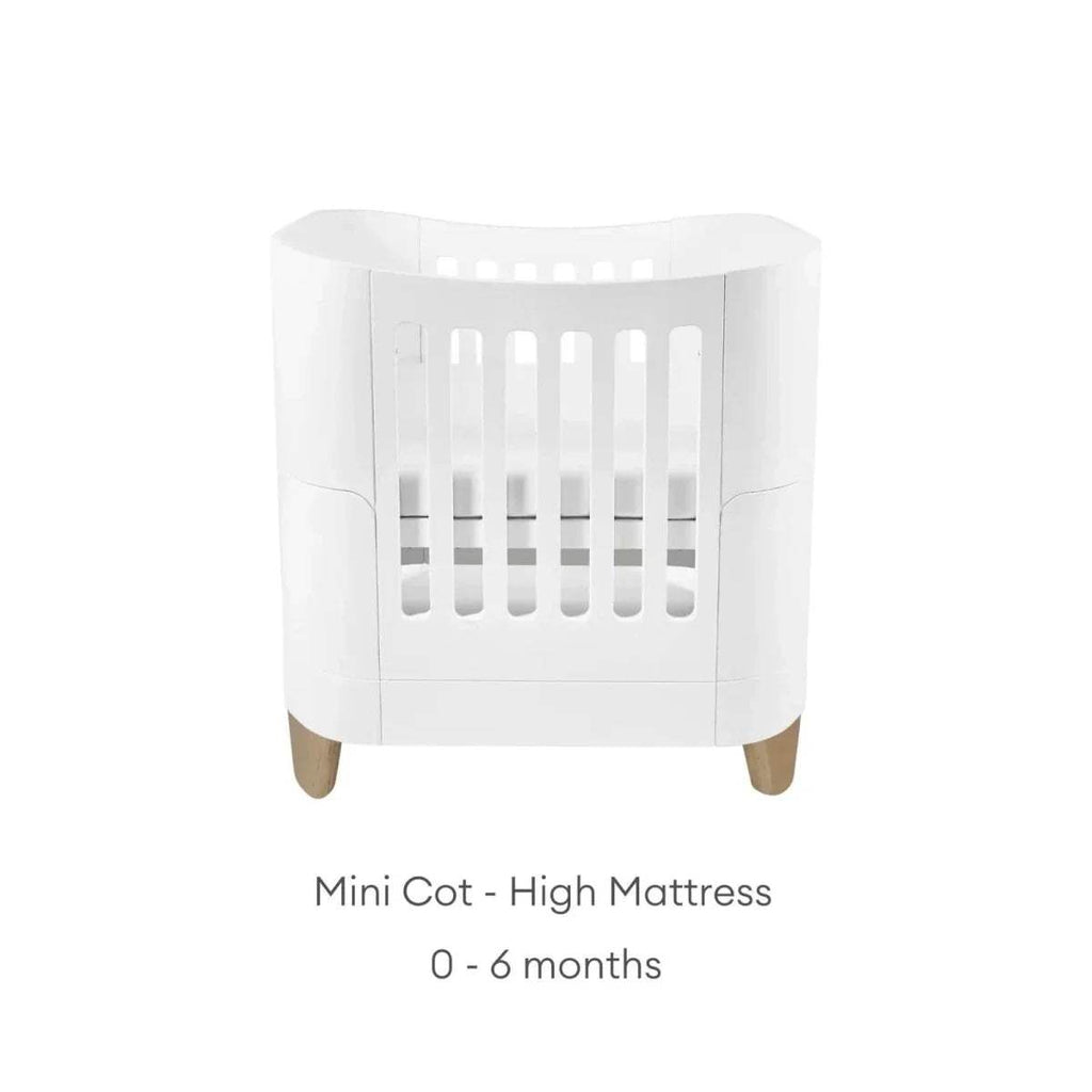 White mini cot with high mattress position, front view