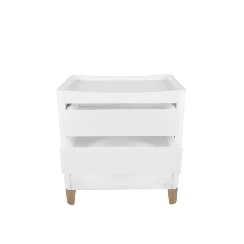 White baby mini cot with open sides and natural wooden legs