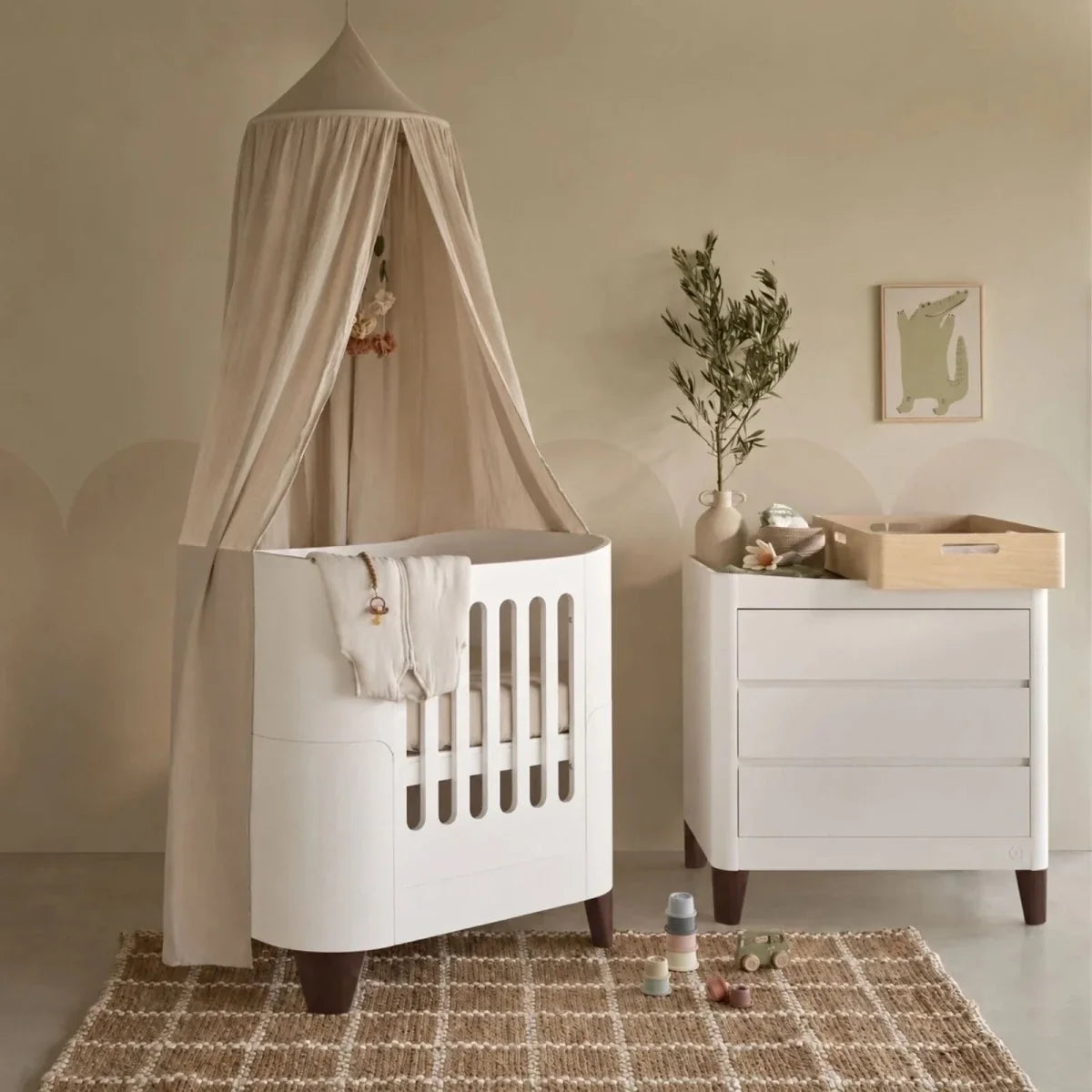 White mini cot with canopy, plus matching white dresser with walnut legs and top