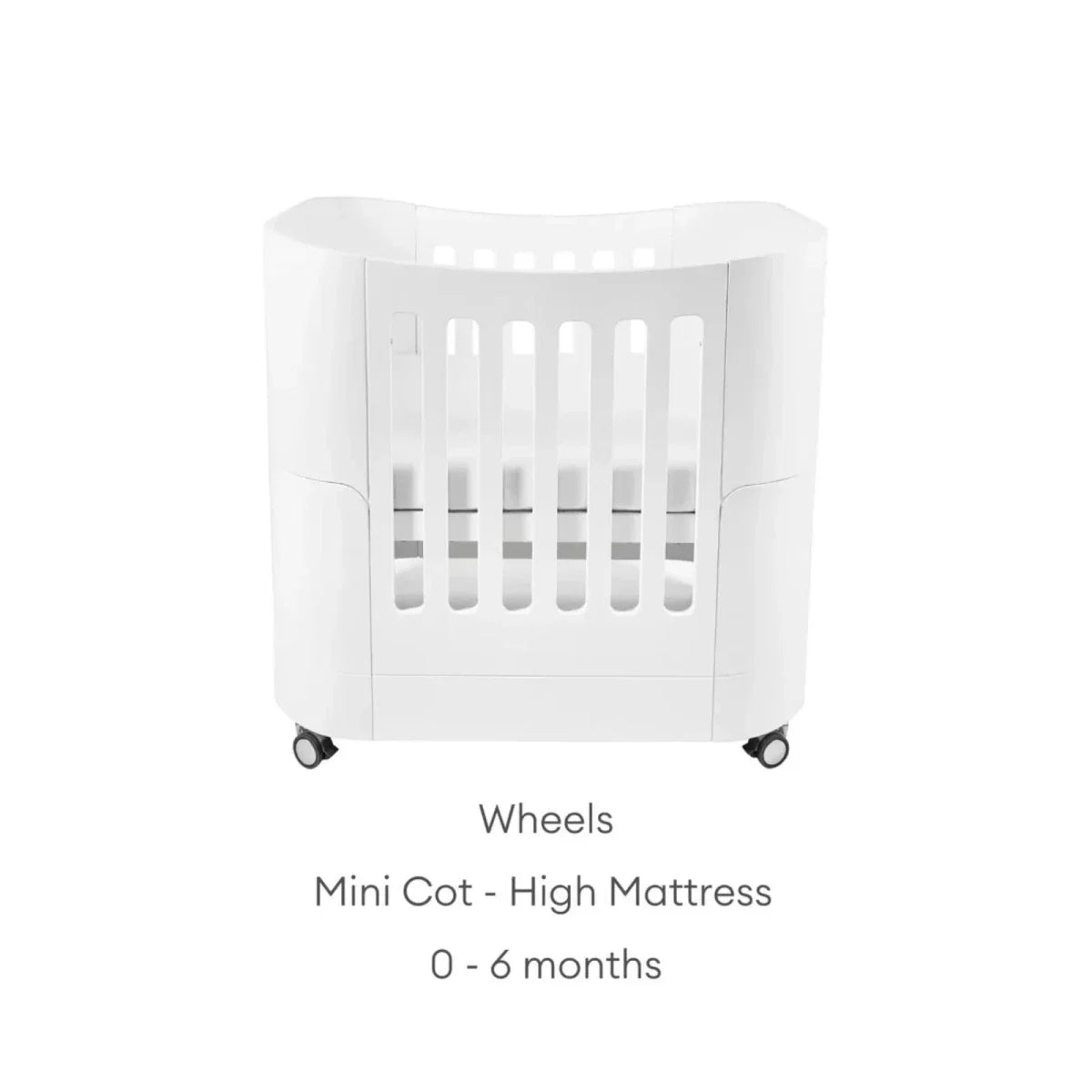White mini cot on wheels with high mattress position and safety rails