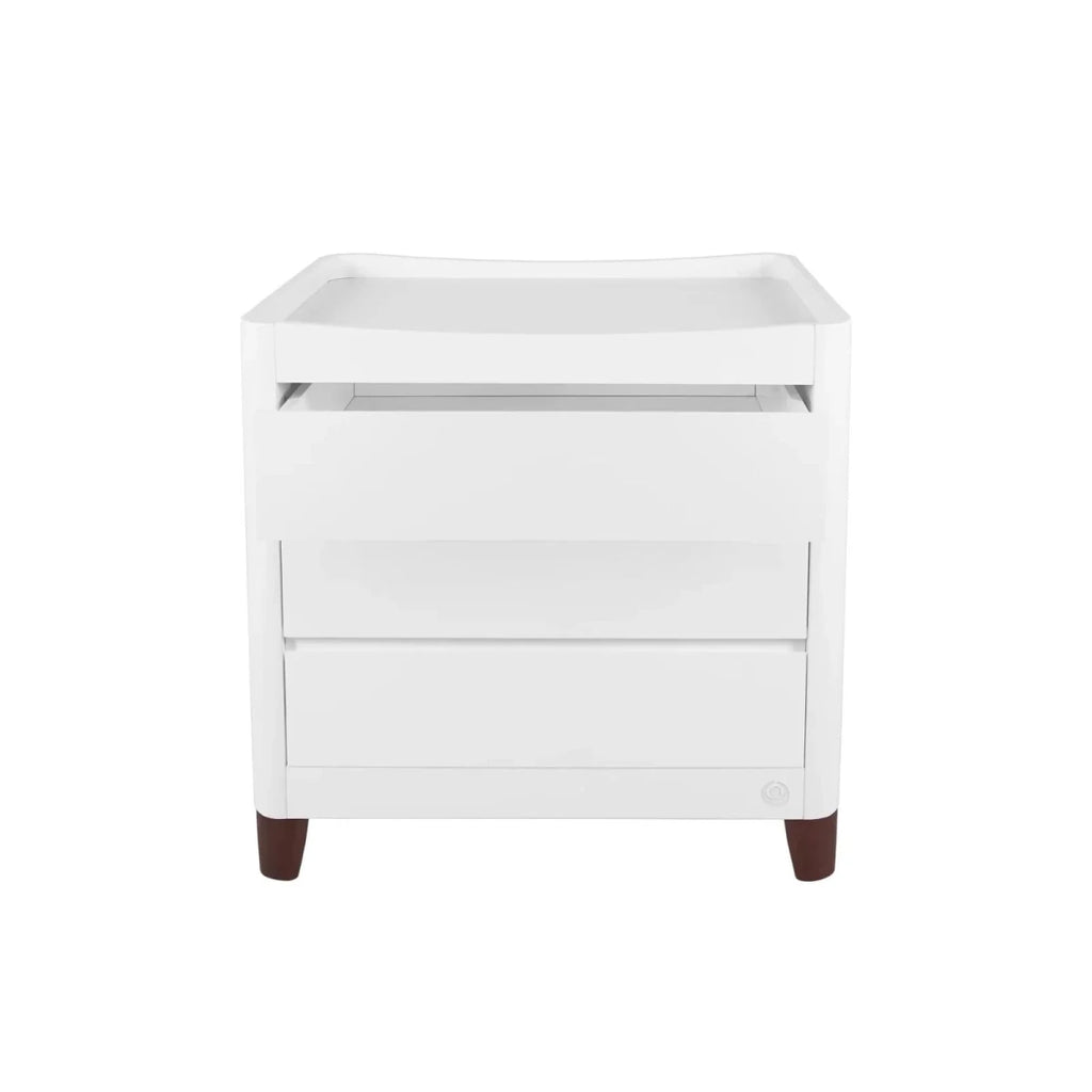White baby dresser with two drawers and top changing tray, walnut-toned feet