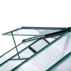 Dark green greenhouse roof with clear polycarbonate panels and metal support ribs