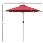 Red patio umbrella with central pole and spread canopy
