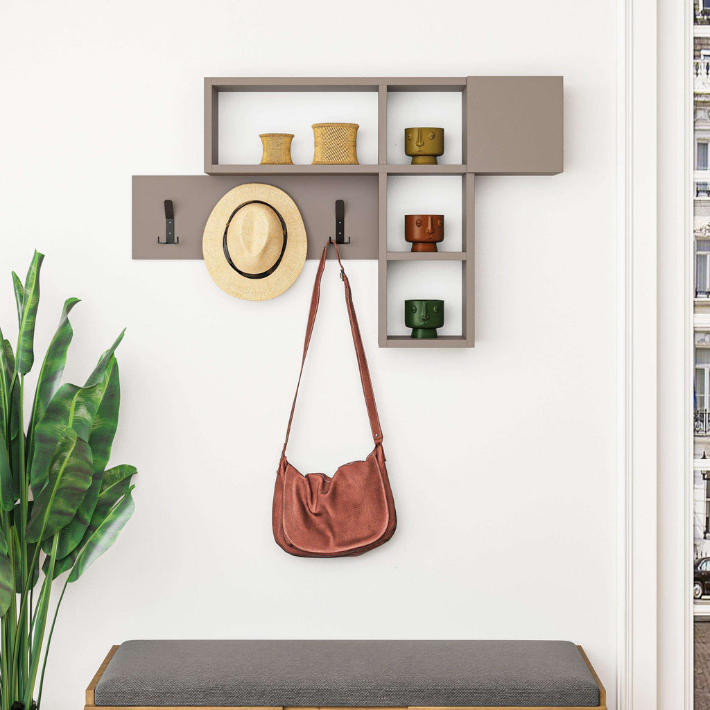 Wall-mounted game hanger with light gray shelves, open cubbies, and three black coat hooks; hat and bag.