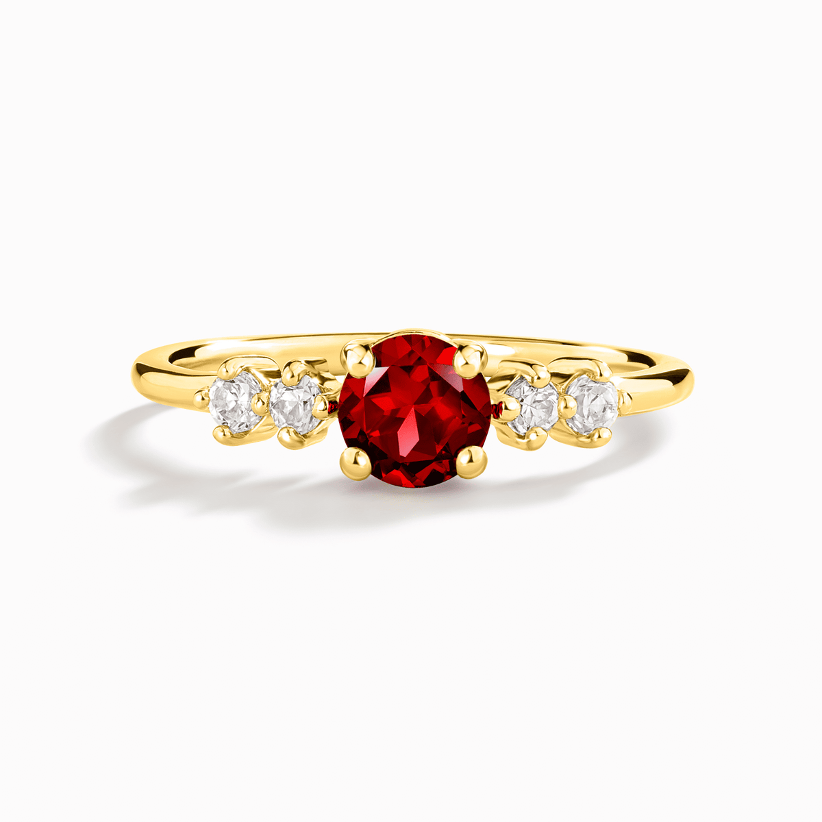 Gold vermeil five-stone ring with round red garnet center and four small clear stones