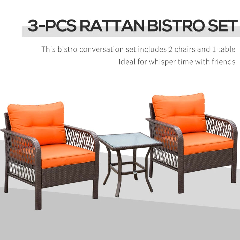 Rattan bistro set with two orange-cushioned armchairs and a small glass table