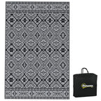 Black and grey geometric outdoor rug with matching black carry bag