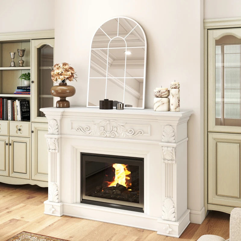 White arched grid mirror above mantel with window-style pane grid design