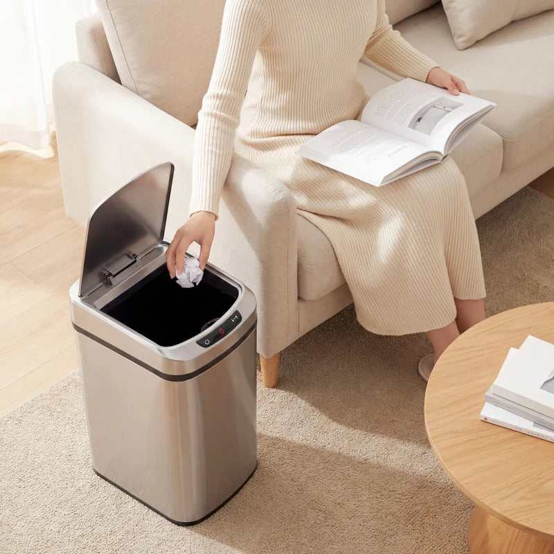 Silver stainless steel touchless sensor trash bin with open lid as bag is added