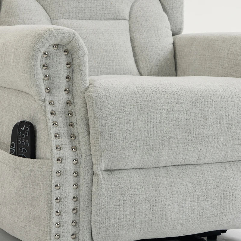 Light grey recliner armrest with built-in control panel and silver studded trim.