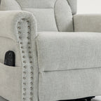 Light grey recliner armrest with built-in control panel and silver studded trim.