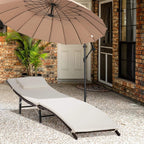 Cream-cushioned rattan sun lounger chair on outdoor patio