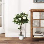 Artificial white rose floral plant in white pot with green leaves and brown trunk
