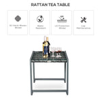 Grey rattan tea table with dark glass top, bottle and wine glasses on surface