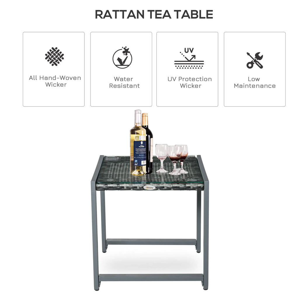 Grey rattan tea table with glass top and hand-woven wicker surface
