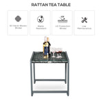 Grey rattan tea table with glass top and hand-woven wicker surface