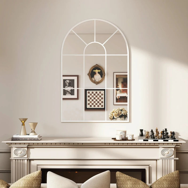 White arched grid mirror on wall with window-style pane grid and framed decor
