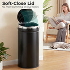 Black trash can with soft-close lid open, showing stainless inner rim
