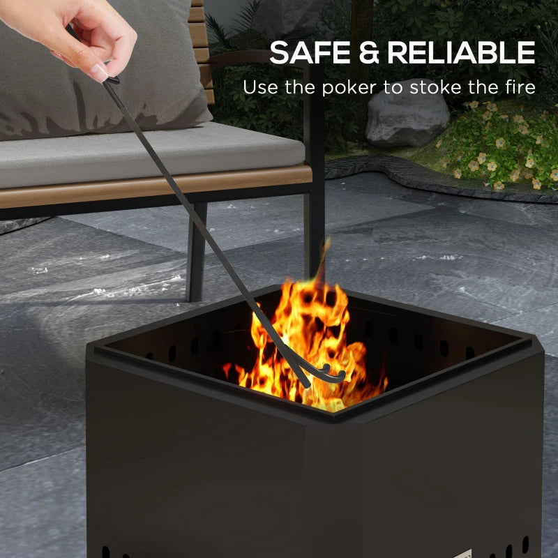 Black square fire pit with open top and side vents, poker stoking burning logs