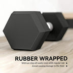 Black hex rubber dumbbell with chrome handle, close-up